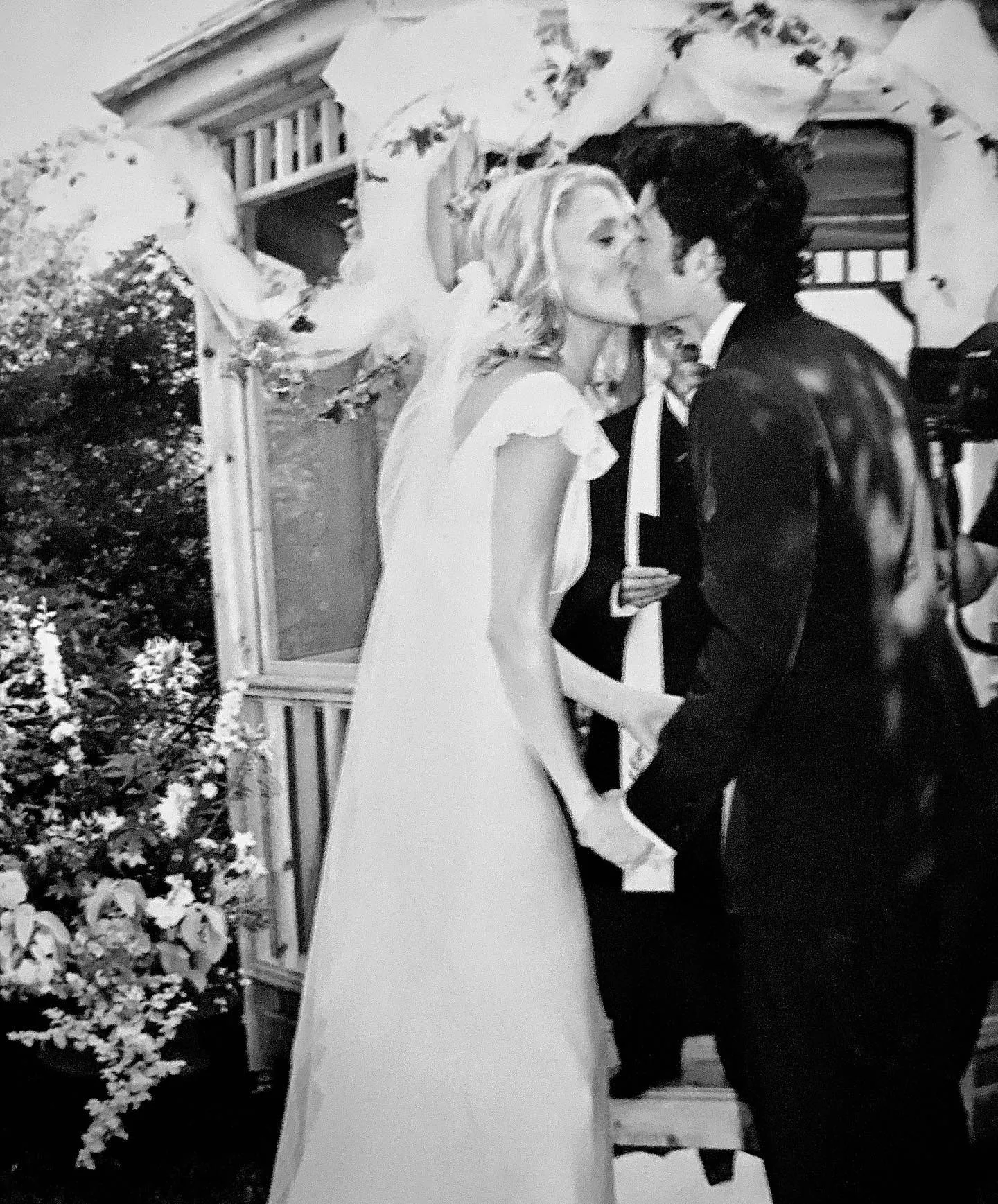 Patrick and Jillian kissing on their wedding day in 1999
