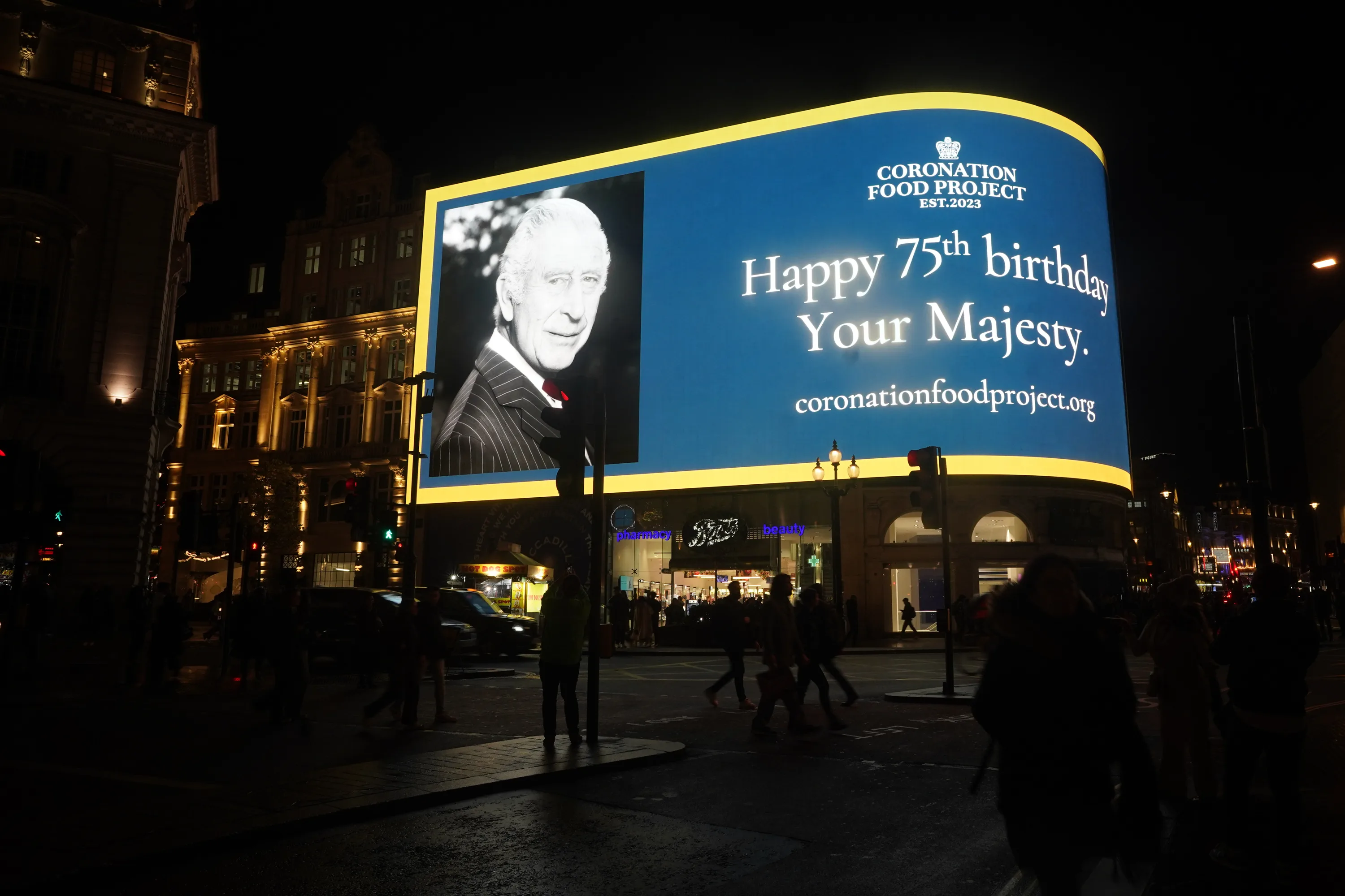 A message is displayed on the Piccadilly Lights in London, to mark the 75th birthday of King Charles III. Picture date: Tuesday November 14, 2023. (Photo by Victoria Jones/PA Images via Getty Images)