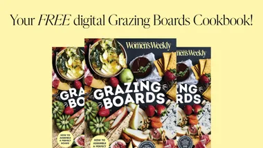 Cover of "Grazing Boards" cookbook with vibrant food images and text promoting a free digital version.