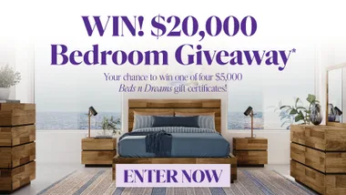 "Bedroom giveaway banner promoting $20,000 contest with Beds n Dreams, featuring a stylish bed and ocean view."