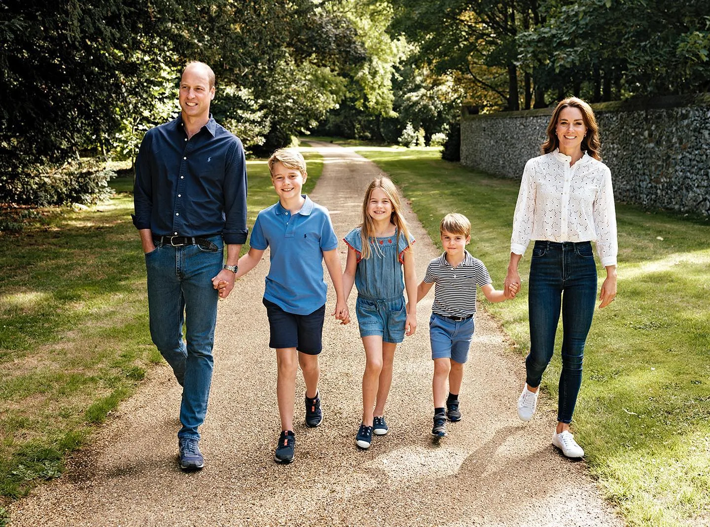 Prince William and Princess Catherine pictured hand in hand with their children for their Christmas cards in 2022