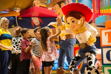 Kids enjoying interacting with Jessie from Toy Story.