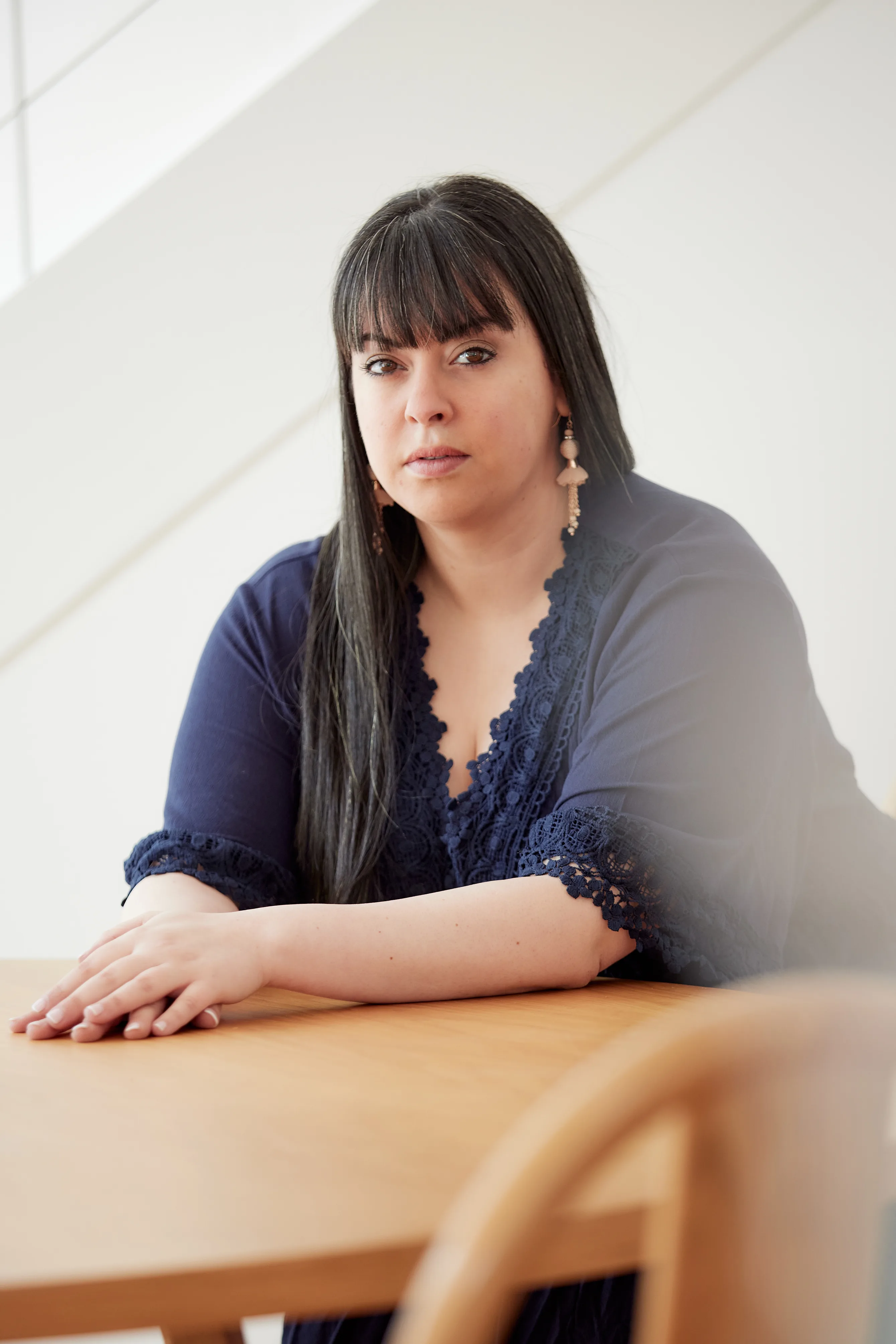 Dassi Erlich sitting at a table