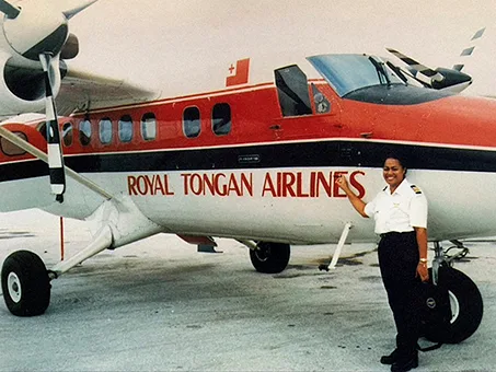 Silva McLeod in front of Royal Tongan Airlines plane