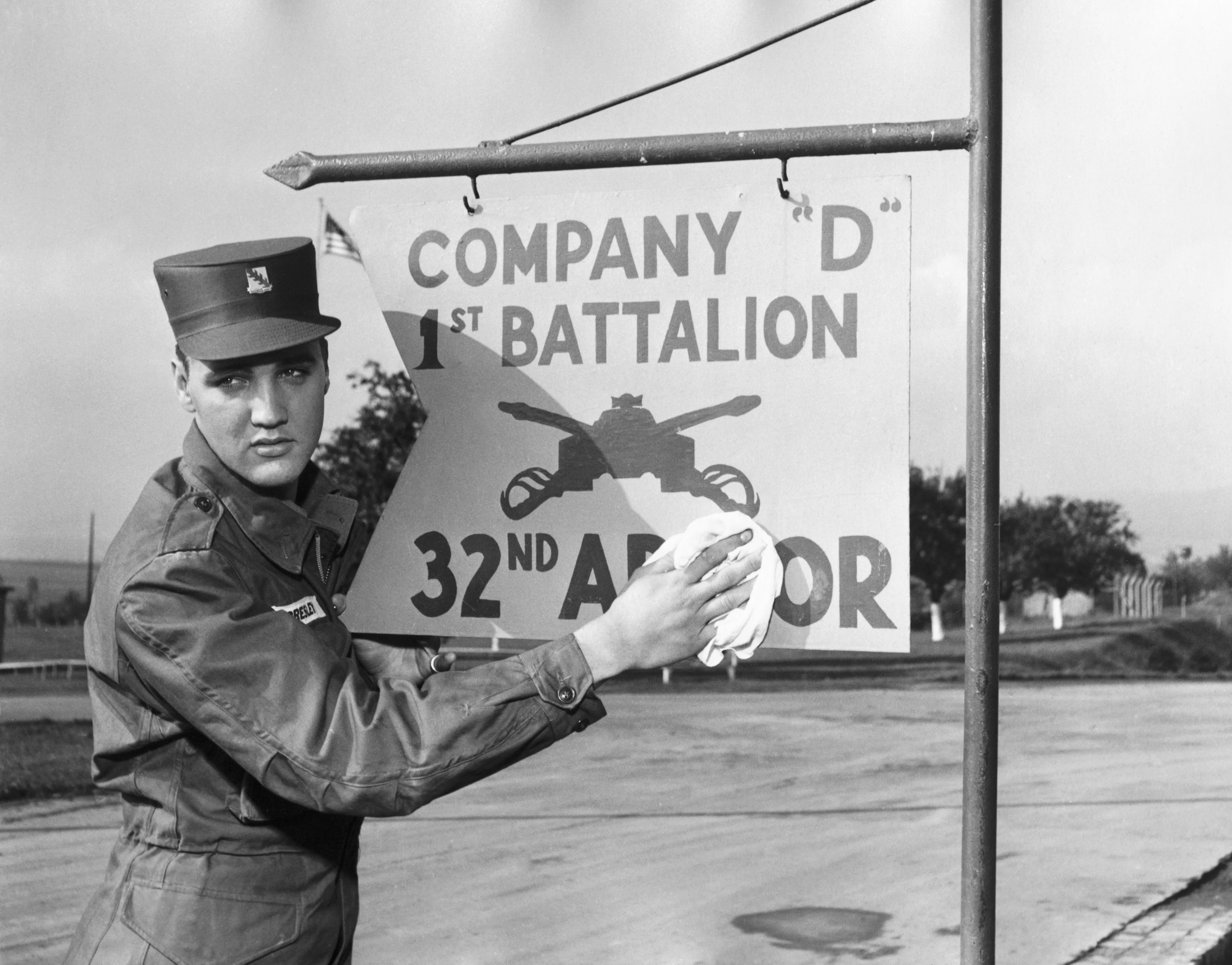 Elvis Presley poses for the camera during his military service at a US base in Germany. (Photo by Vittoriano Rastelli/Corbis via Getty Images)
