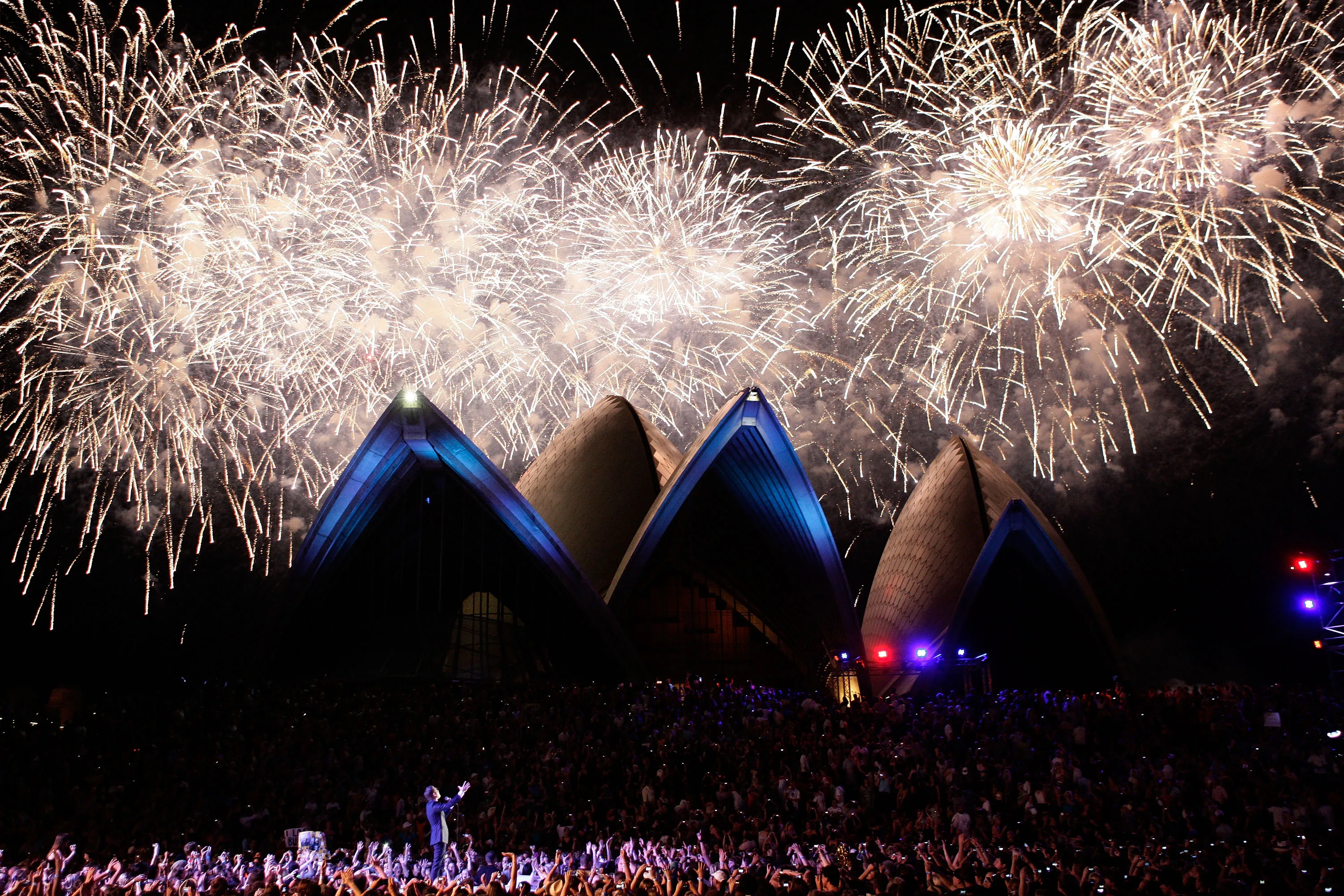 Michael Buble performs as fireworks illuminate the Sydney Opera House during the 2009 Australian Idol Final at the Sydney Opera House on November 22, 2009 in Sydney.