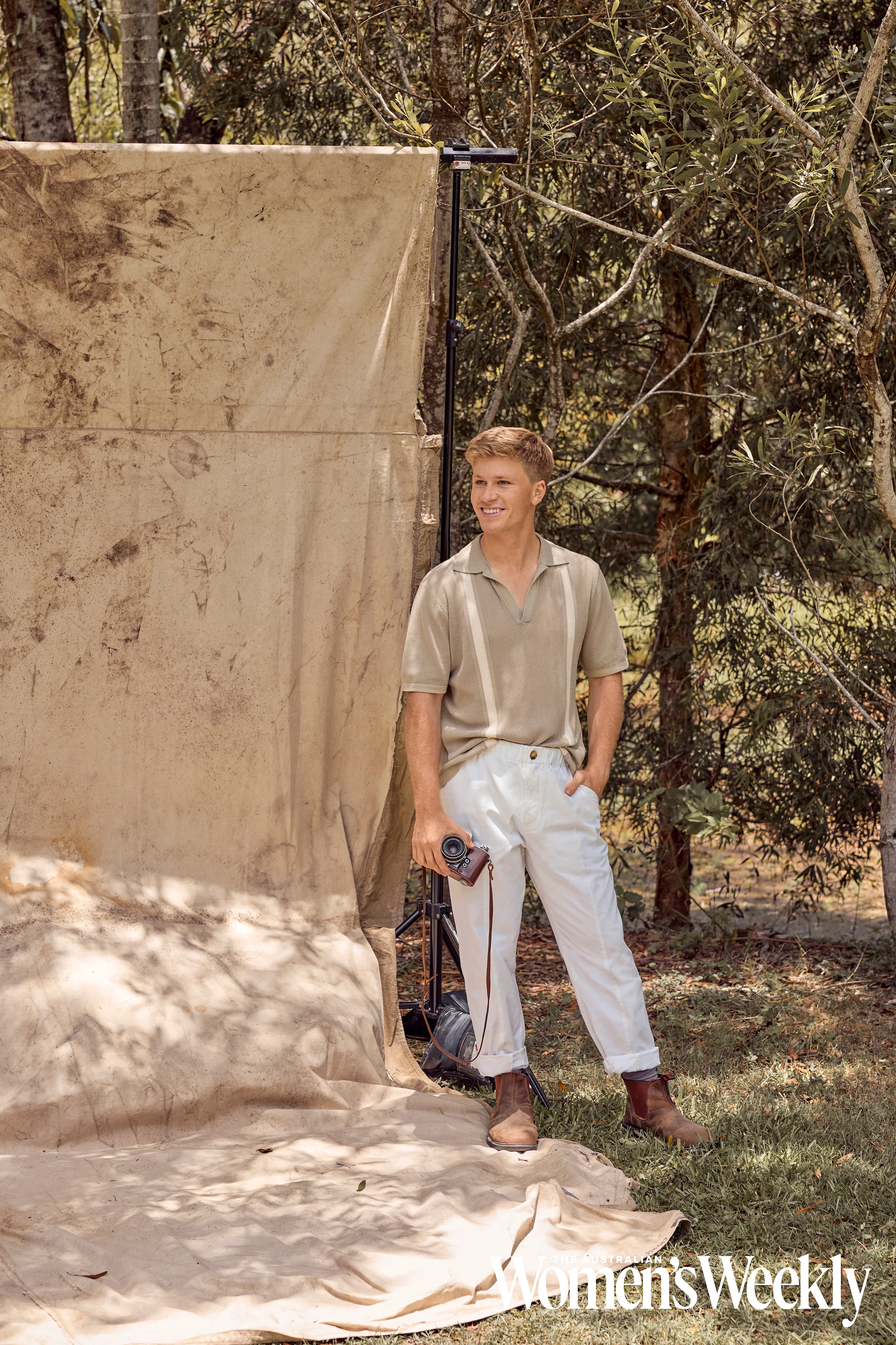 Robert Irwin holding a camera at Australia Zoo