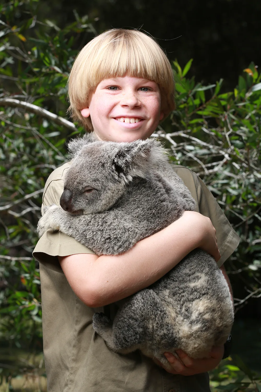 NOVEMBER 29, 2013: SUNSHINE COAST, QLD. Robert Irwin, son of the late Crocodile Hunter Steve Irwin, poses with a Koala during a photo shoot at Australia Zoo in Beerwah on the Sunshine Coast, Queensland. (Photo by Russell Shakespeare / Newspix)