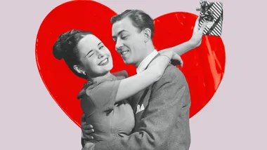A couple embracing with a red heart background; the woman is winking and holding a small gift.