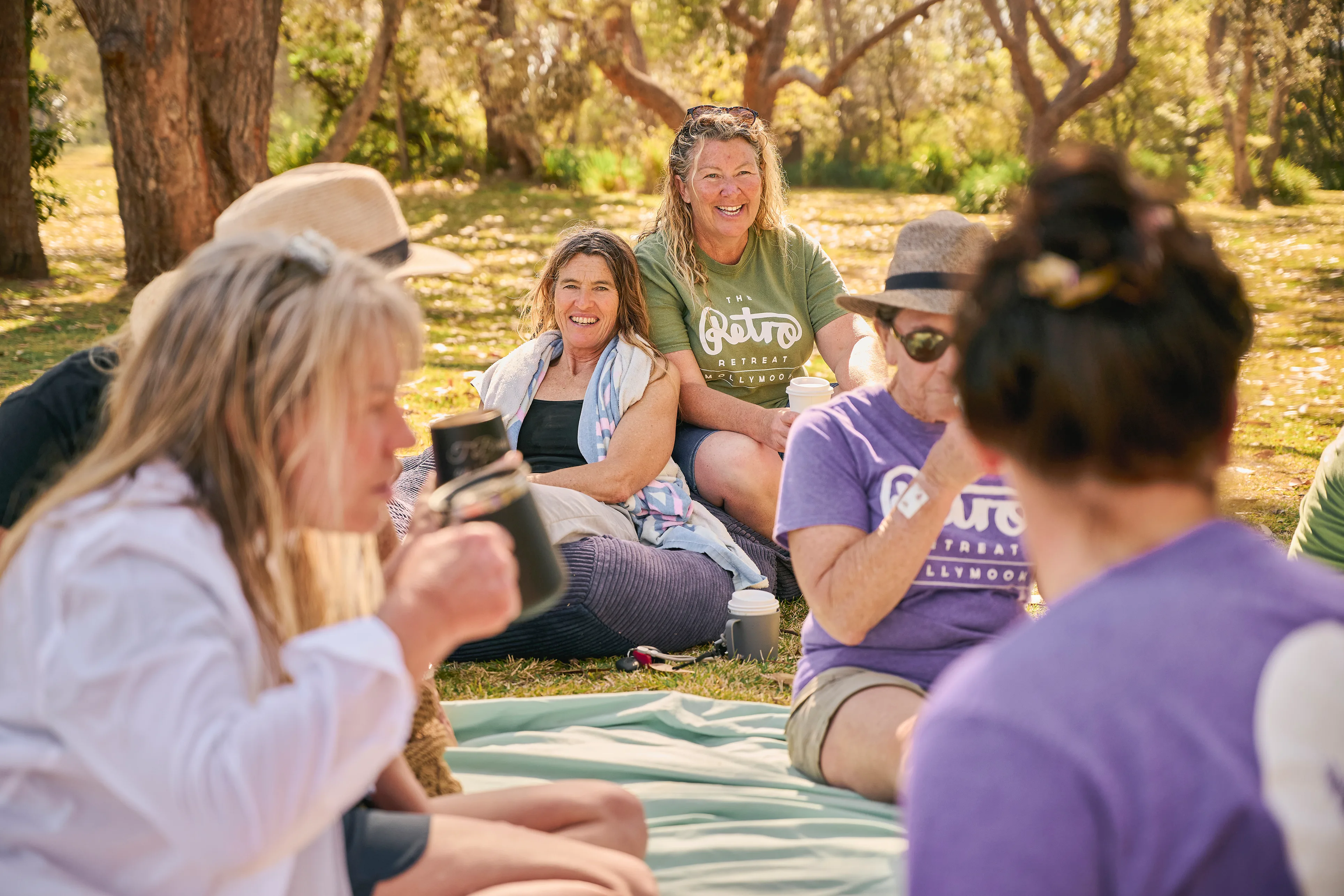 Australian female surfers gathered around at a retreat.
