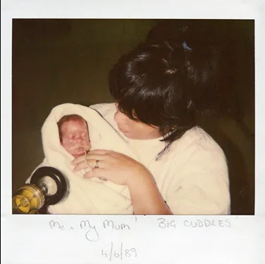 Elly-May as a newborn baby being held by mother Jane.