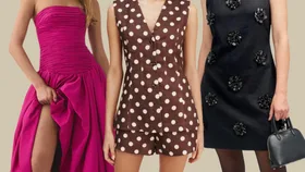 Three women wearing a pink strapless gown, a brown polka dot suit, and a black dress with floral accents.