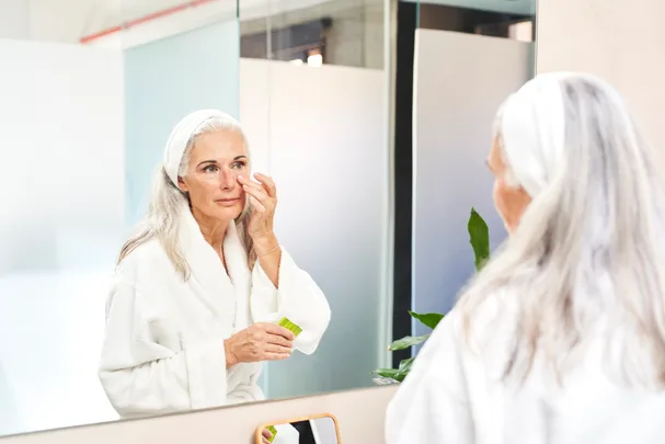 woman applying face cream