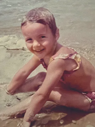 Young Julie Goodwin at the beach. Picture supplied.