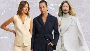 Three women in stylish suits, each in different colors and styles, standing against a metallic background.
