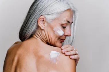 Image of a beautiful senior woman posing on a beauty photo session. Middle aged woman on a colored background. Concept about body positivity, self esteem and body acceptance