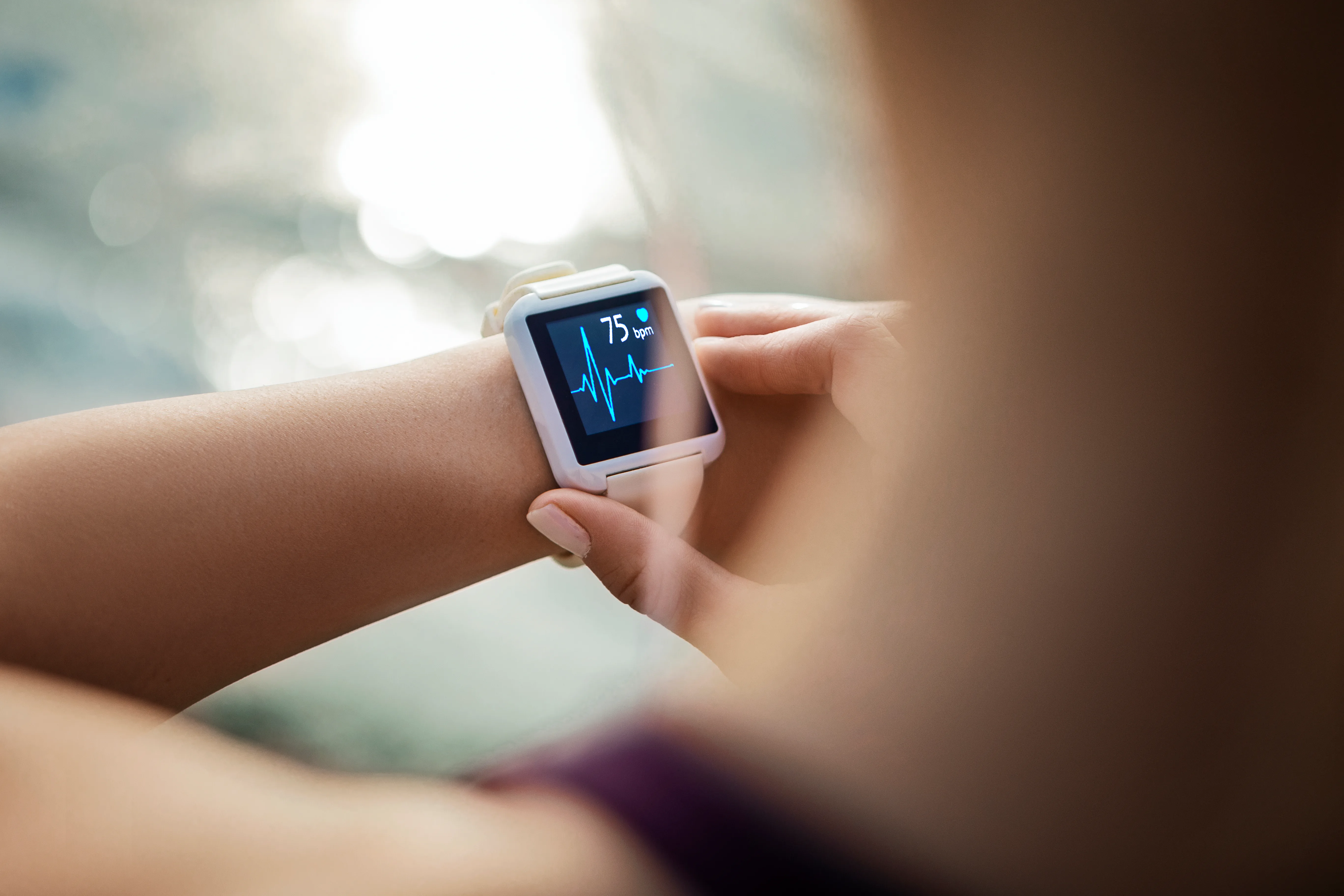 Sporty Woman Looking At Her Smart Watch
