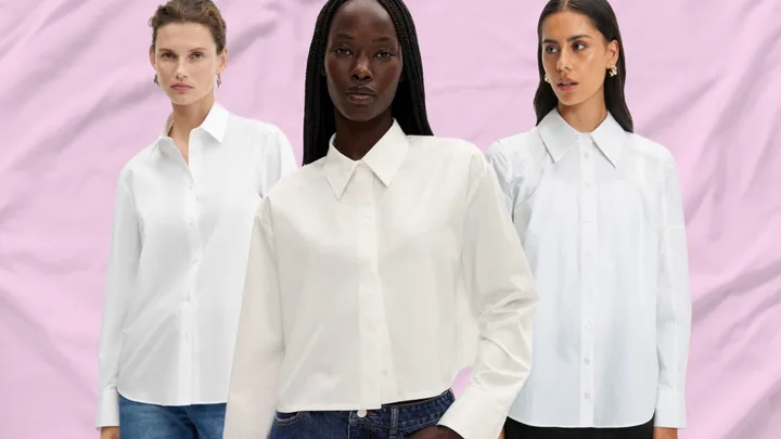 Three women modeling white button-up shirts against a pink background.