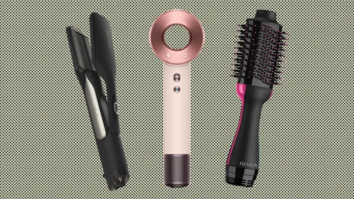 Three hair styling tools on a dotted background: a straightener, a hairdryer, and a round brush dryer.