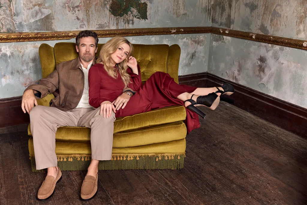 Patrick Brammell and Harriet Dyer on a couch. 