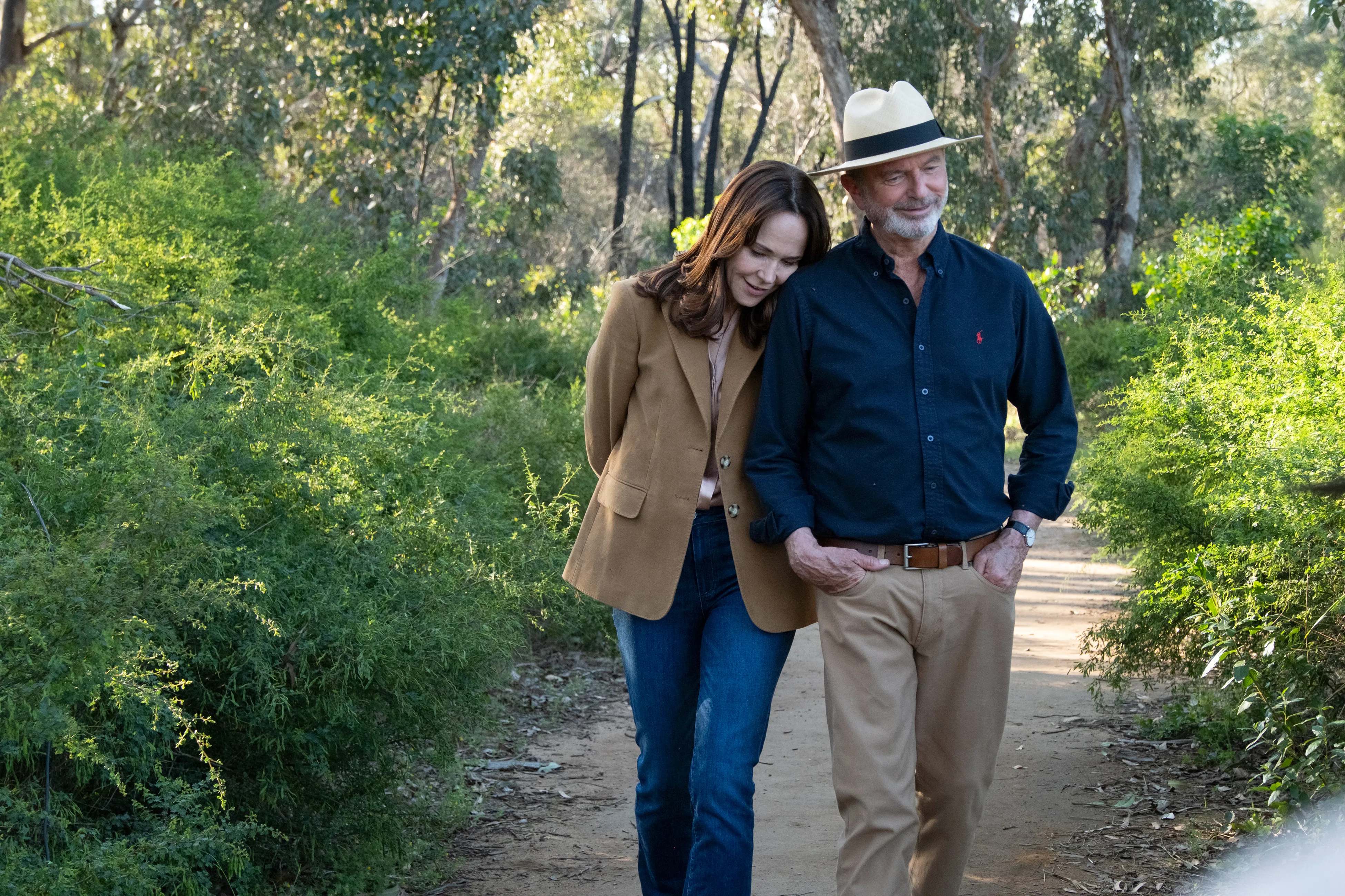 A couple strolling through bushland