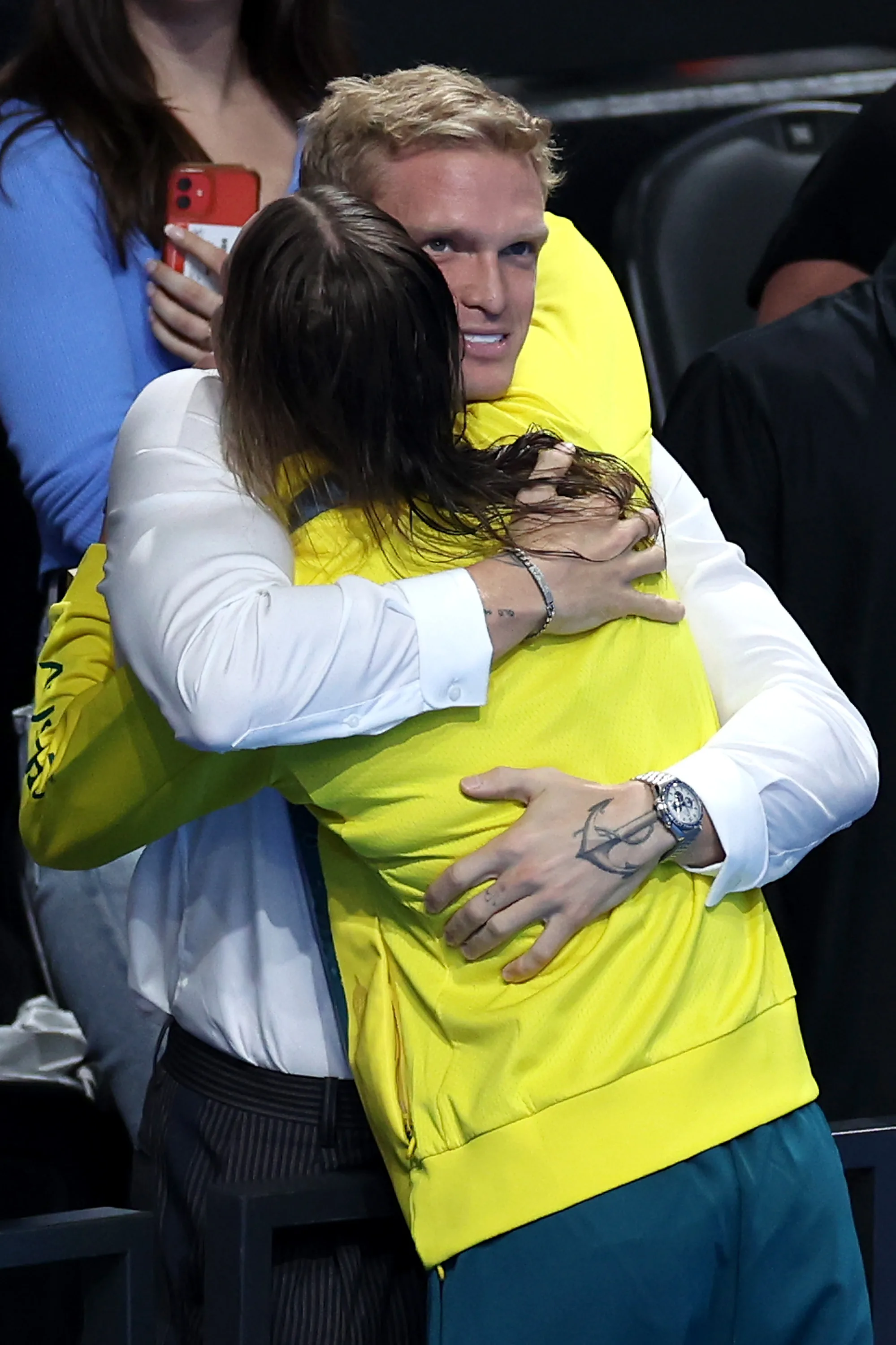 Cody and Emma embrace