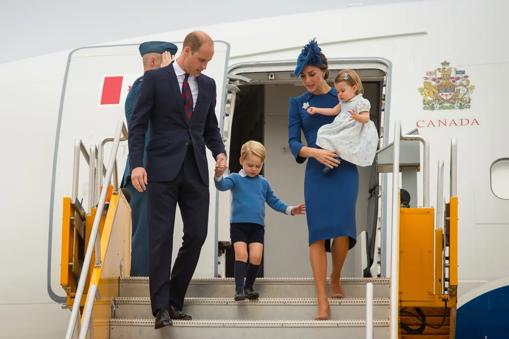 the royal travel rule - Prince William and a young Prince George disembark from a flight along with Princess Catherine and Princess Charlotte