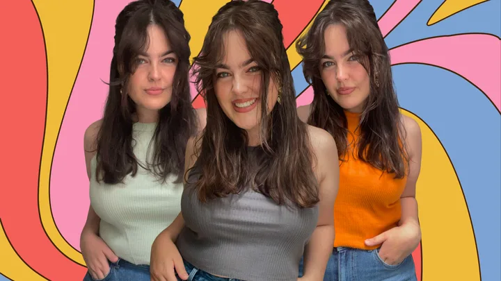 Three smiling women with long dark hair in colorful tops against a vibrant, swirling background.