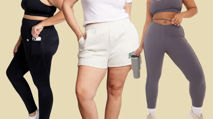 Three women wearing activewear: black leggings, white shorts, and grey leggings holding a tumbler, on a beige background.