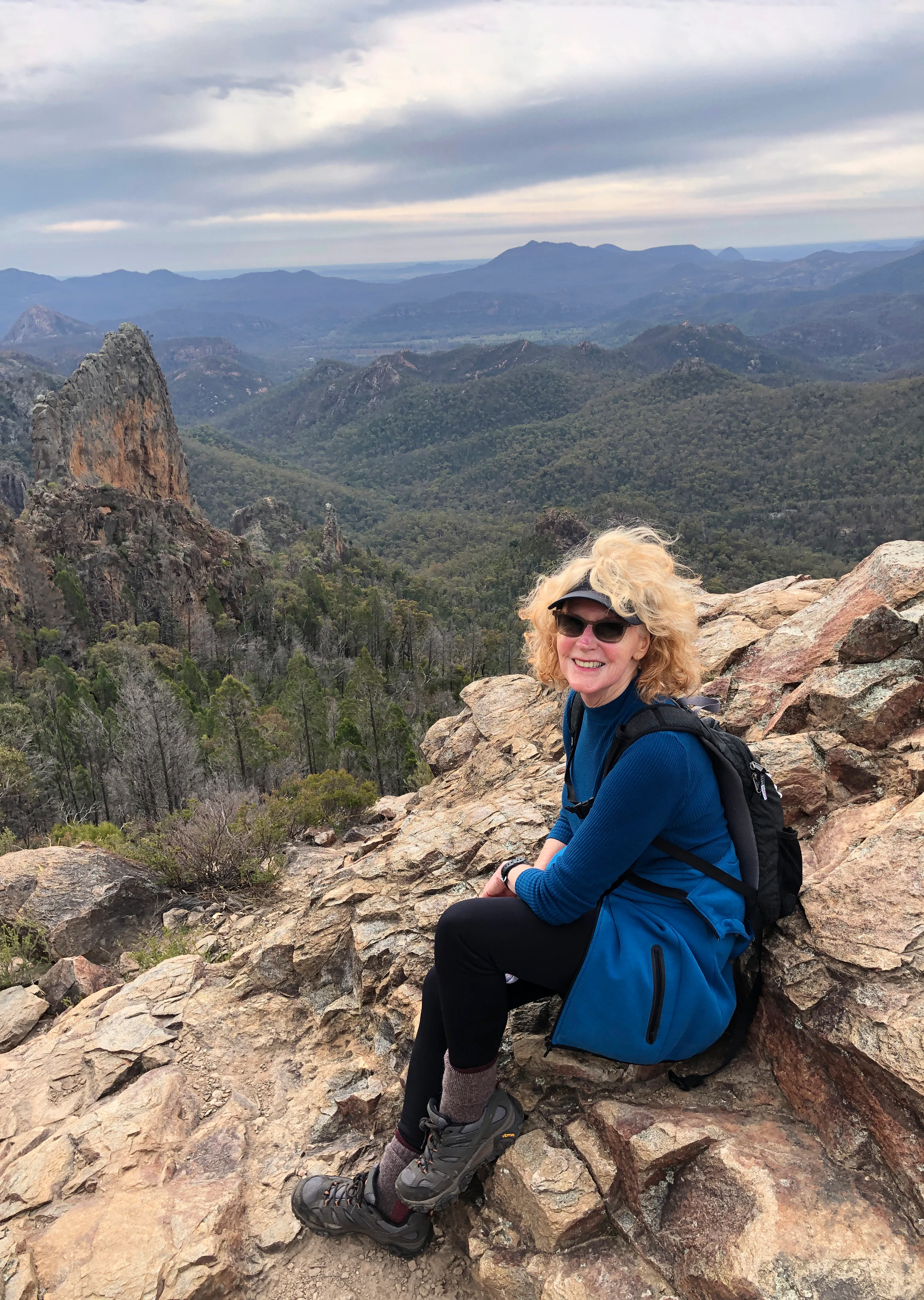 Anne Riches looks at a view while hiking. 