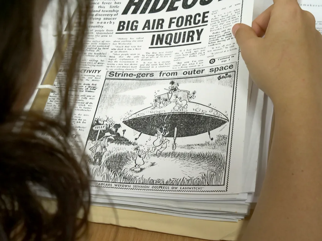 Newspaper cartoon about a crop circle in Australia.
