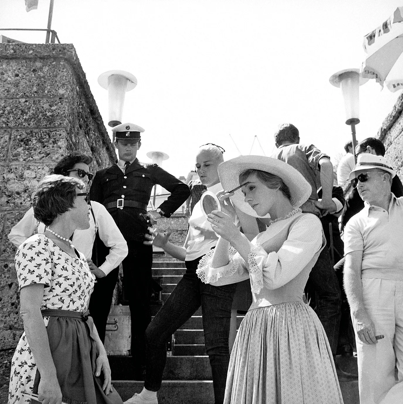 Julie Andrews adjusts her makeup on the set of The Sound of Music.