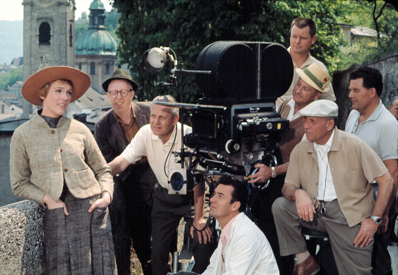Julie Andrews and a group of camera men operating a video camera on The Sound of Music set