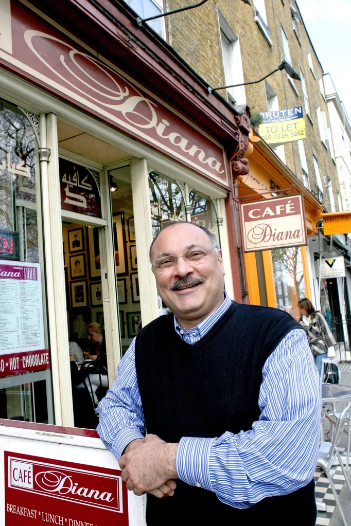 Abdul Daoud, founder of Cafe Diana, poses outside his cafe