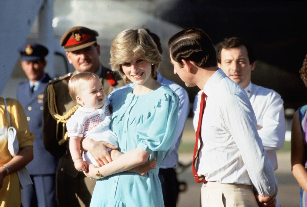 Prince Charles, Prince of Wales and Diana, Princess of Wales. Diana holds a young boy.