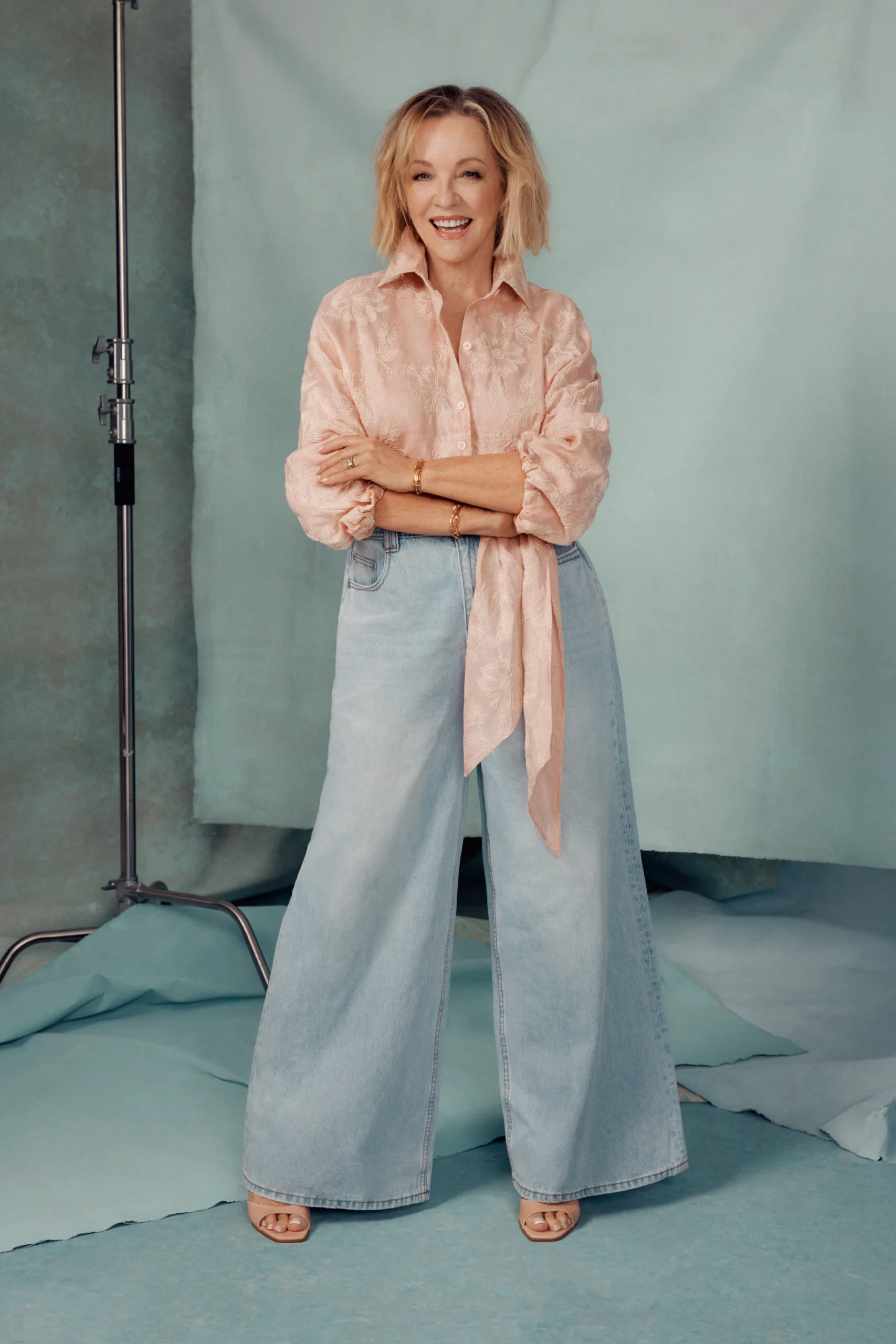 Rebecca Gibney wearing Scanlan Theodore shirt and Aje jeans. Zara shoes.