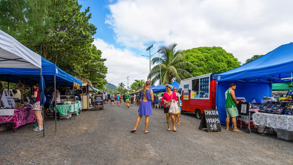 a street lined with stalled and food trucks