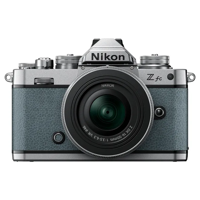 Nikon Z fc camera with classic design, silver accents, viewfinder, and Nikkor lens, front view.