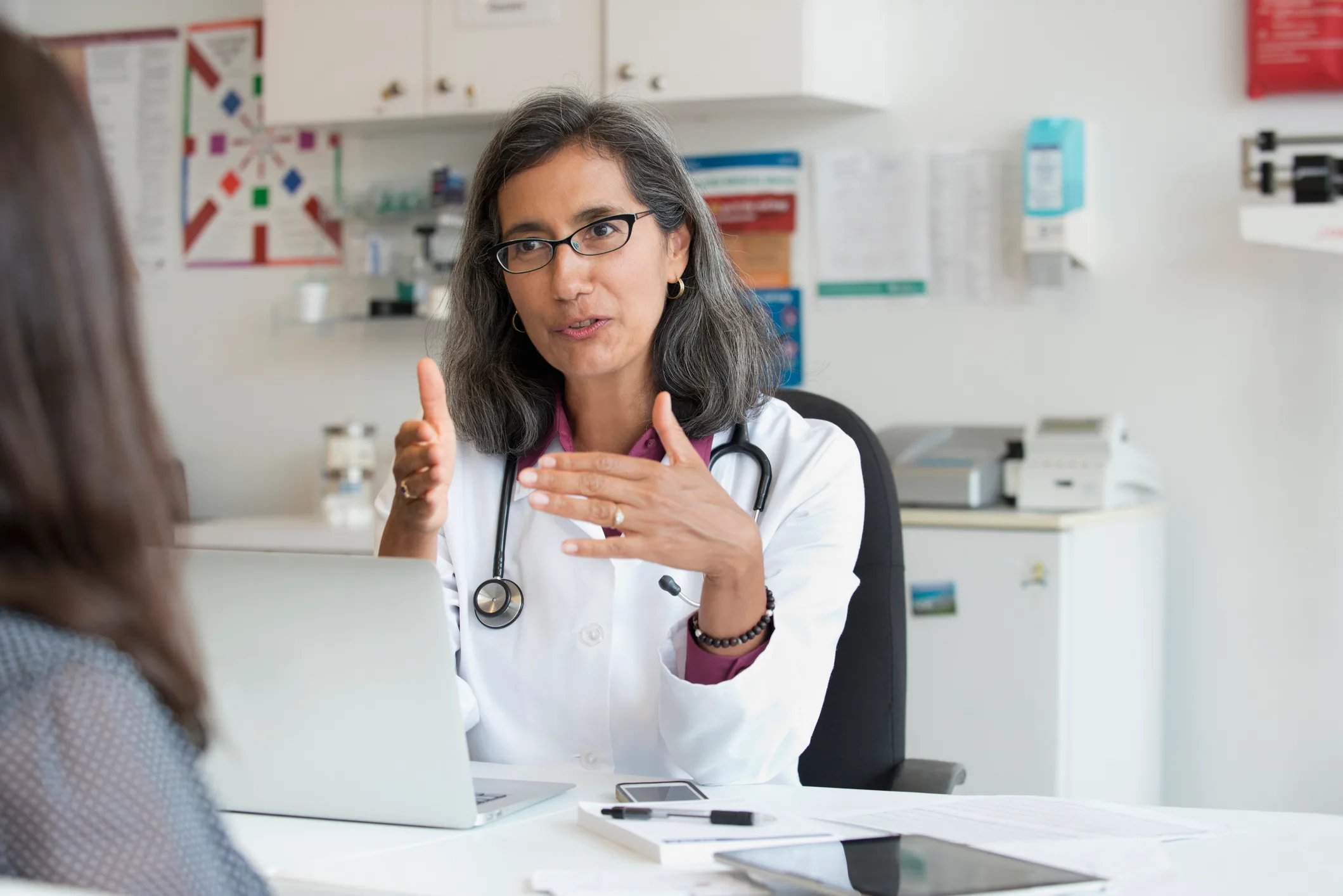 Doctor talking to patient during appointment