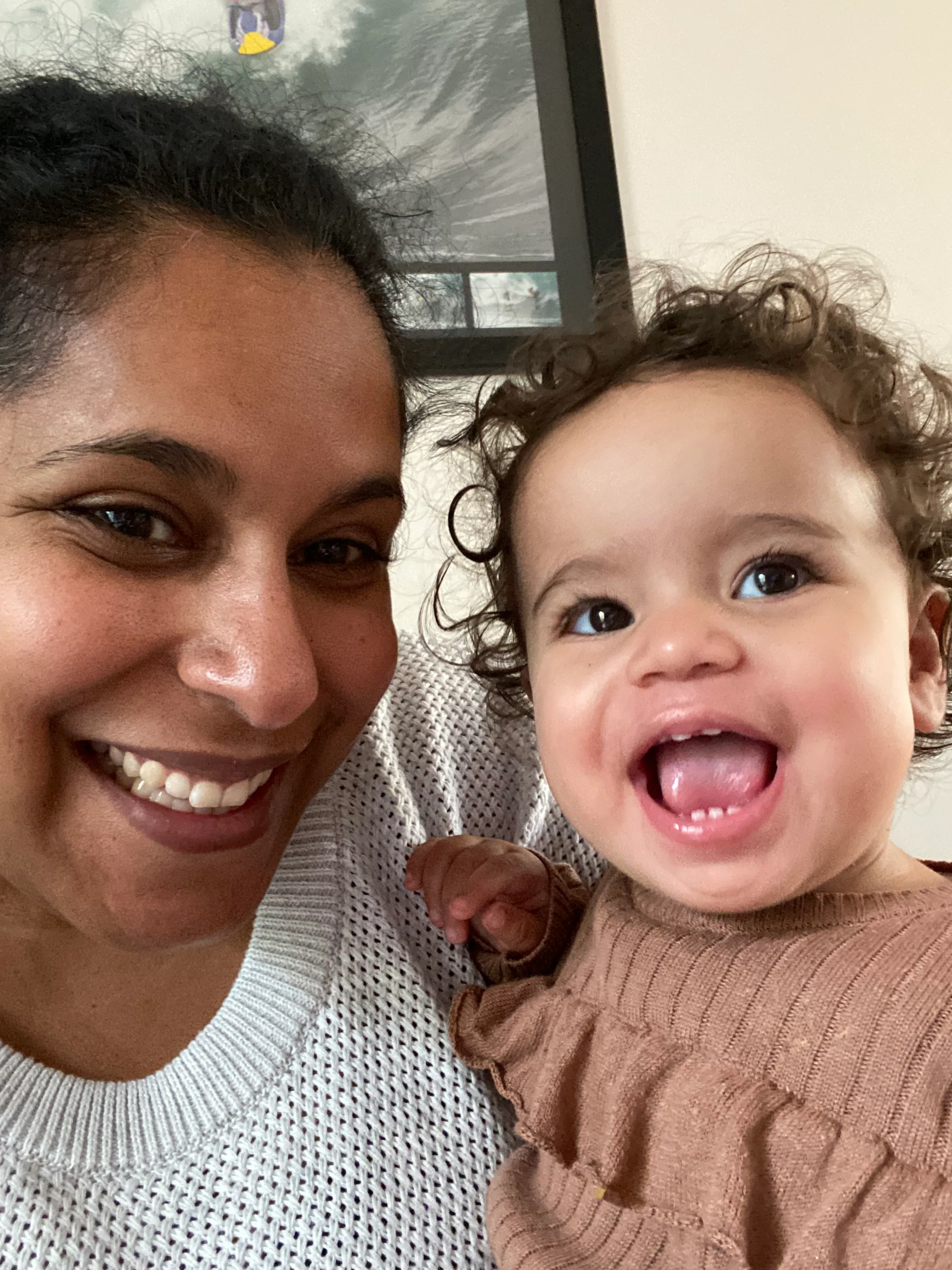 Tahlia and her mother Yasmine have matching brown curls and big smiles.
