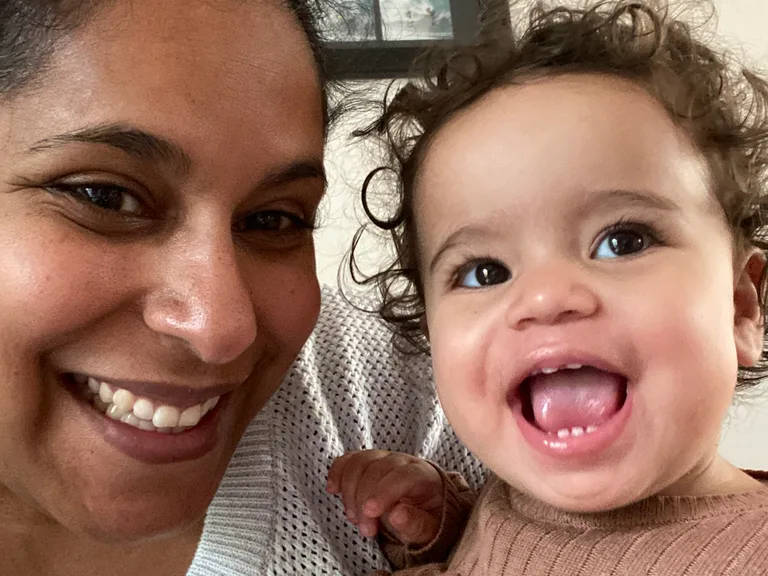 Tahlia and her mother Yasmine have matching brown curls and big smiles.