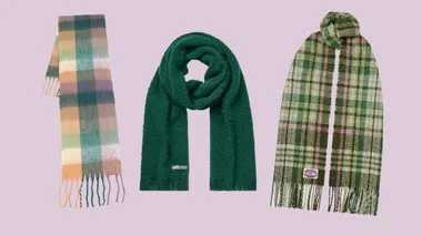 Three scarves: left plaid in pastel hues, center solid green, right plaid in green and pink tones, all on a light purple background.