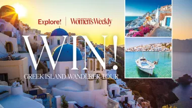 Win a Greek Island wanderer tour with Australian Women's Weekly; features stunning Santorini views at sunset.