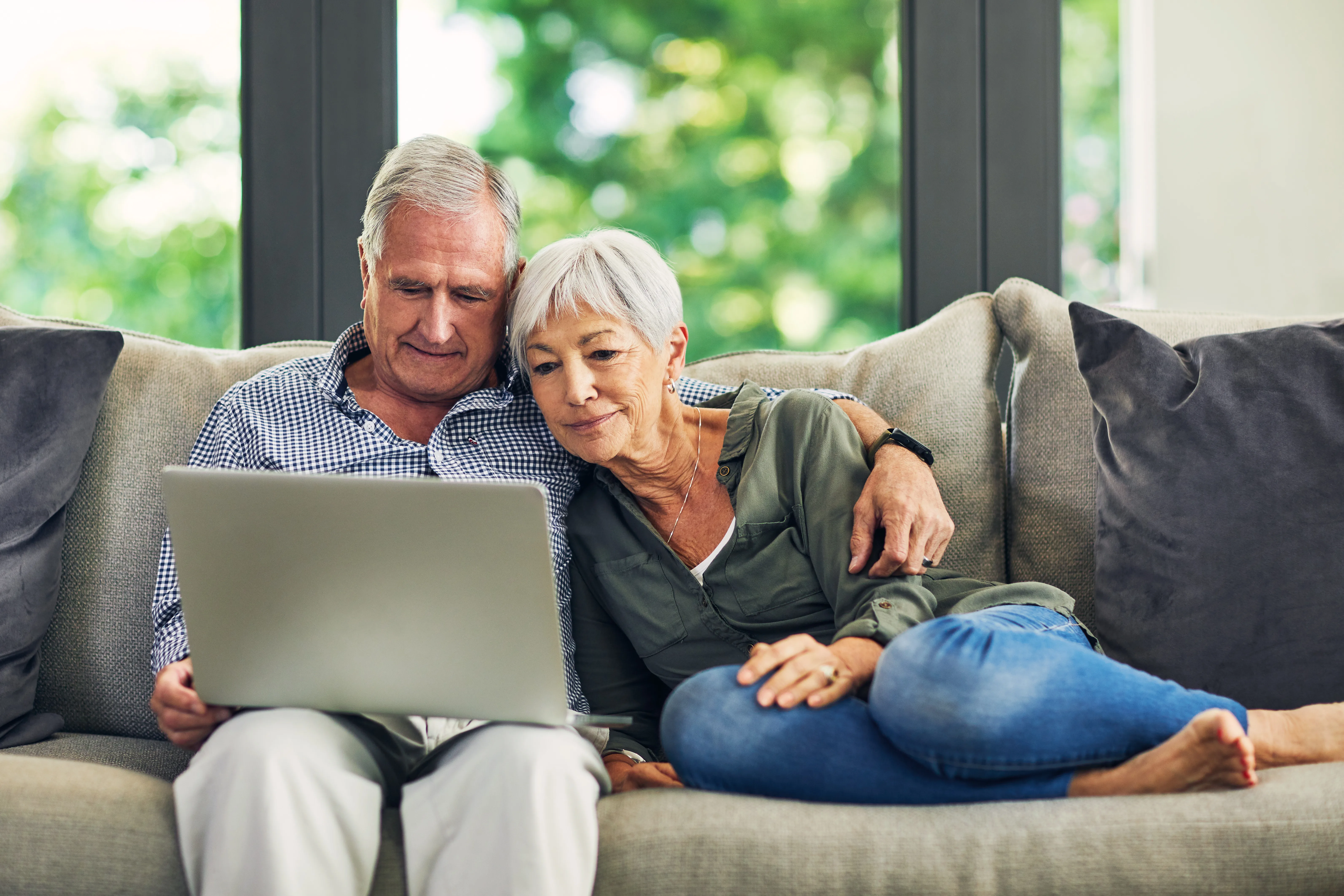 what is doxxing? Older couple looking at a laptop