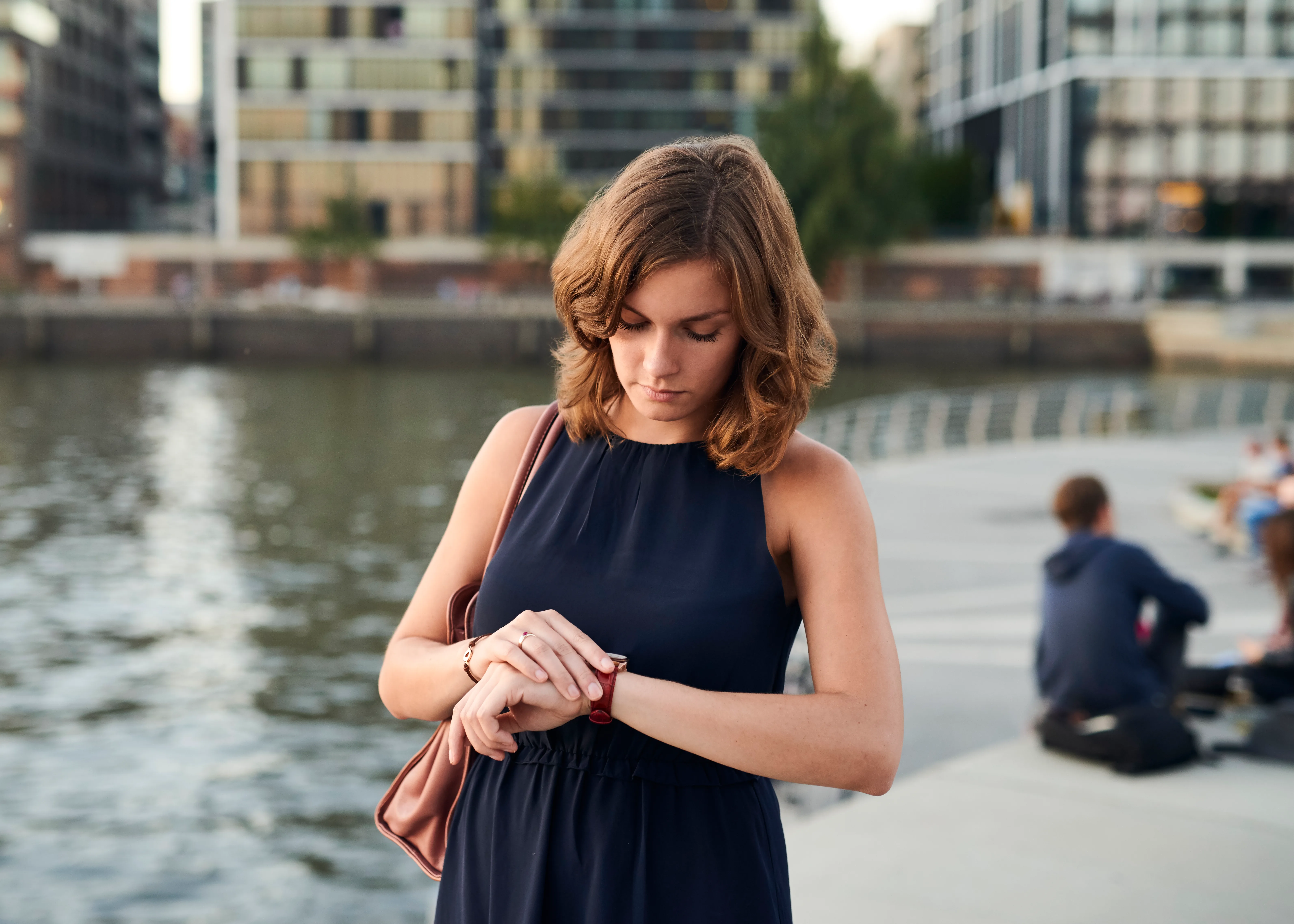 daylight savings - woman looking at her watch