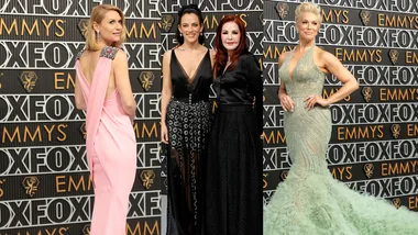 Four women in elegant gowns pose at the Fox Emmys event.