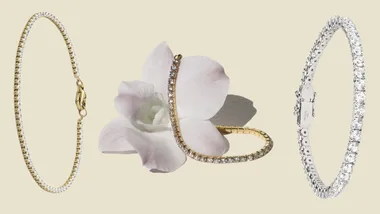 Three diamond tennis bracelets in gold and silver styles with a white orchid on a beige background.