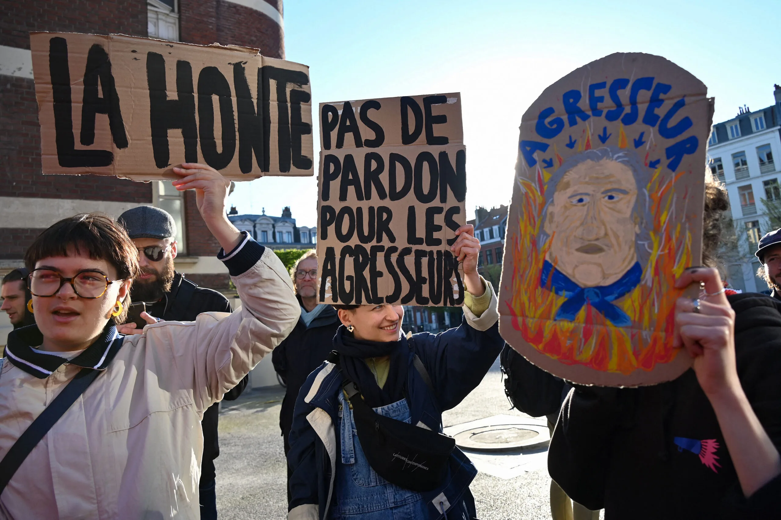 Protestors rally against Depardieu. 
