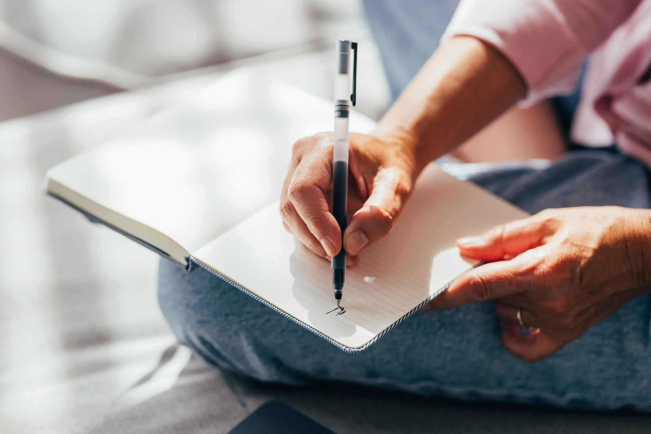 Woman writing in notebook