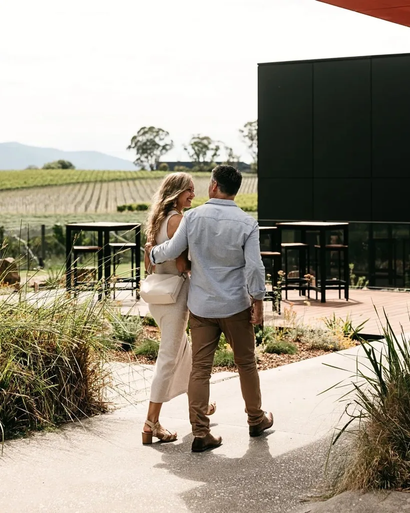 A man and a woman walk into Oakridge Cellar Door in the Yarra Valley.